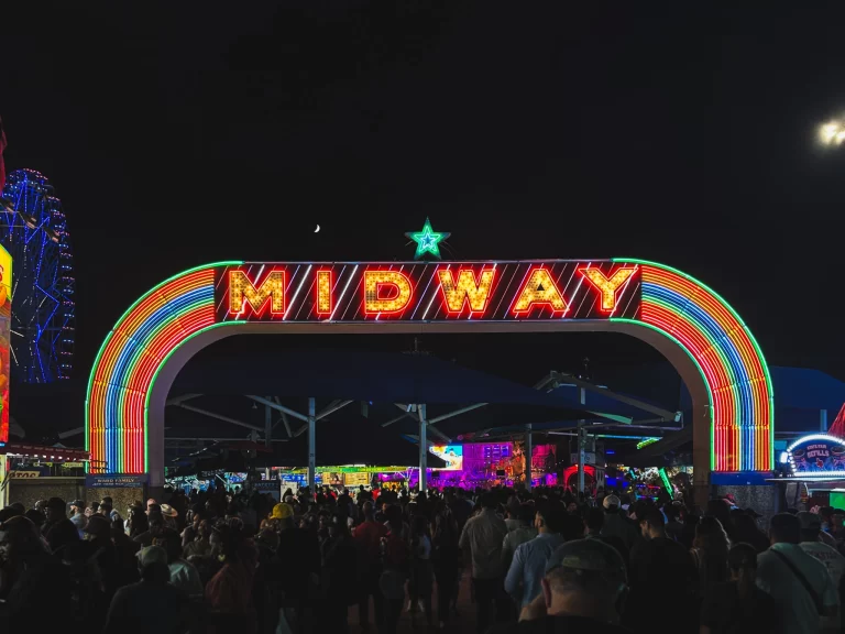 night photo of the midway sign at the state fair of texas